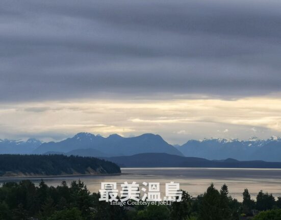 Aerial view of Campbell River coastline and the Discovery Passage during sunset, Vancouver Island, BC.