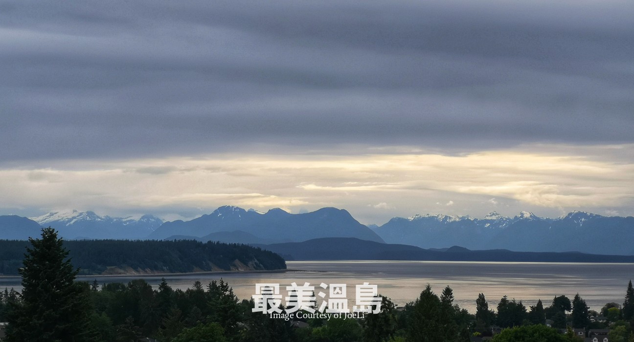 Aerial view of Campbell River coastline and the Discovery Passage during sunset, Vancouver Island, BC.